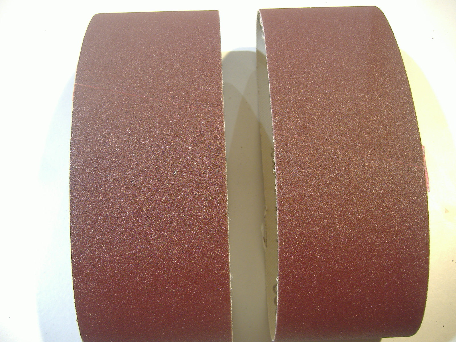 TWO 2 1/2″ X 16″ SANDING BELTS 150 GRIT