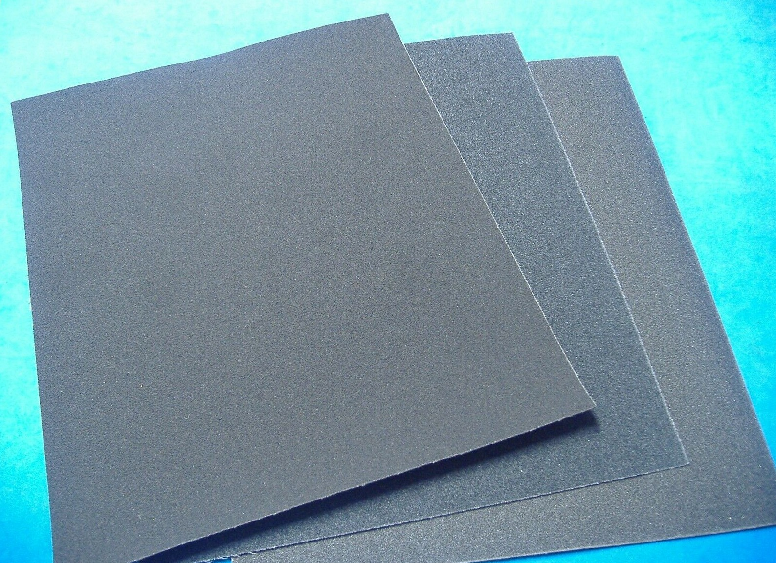 LOT OF THREE 9 X 11 ASSORTED GRIT EMERY CLOTH FINE MEDIUM COARSE