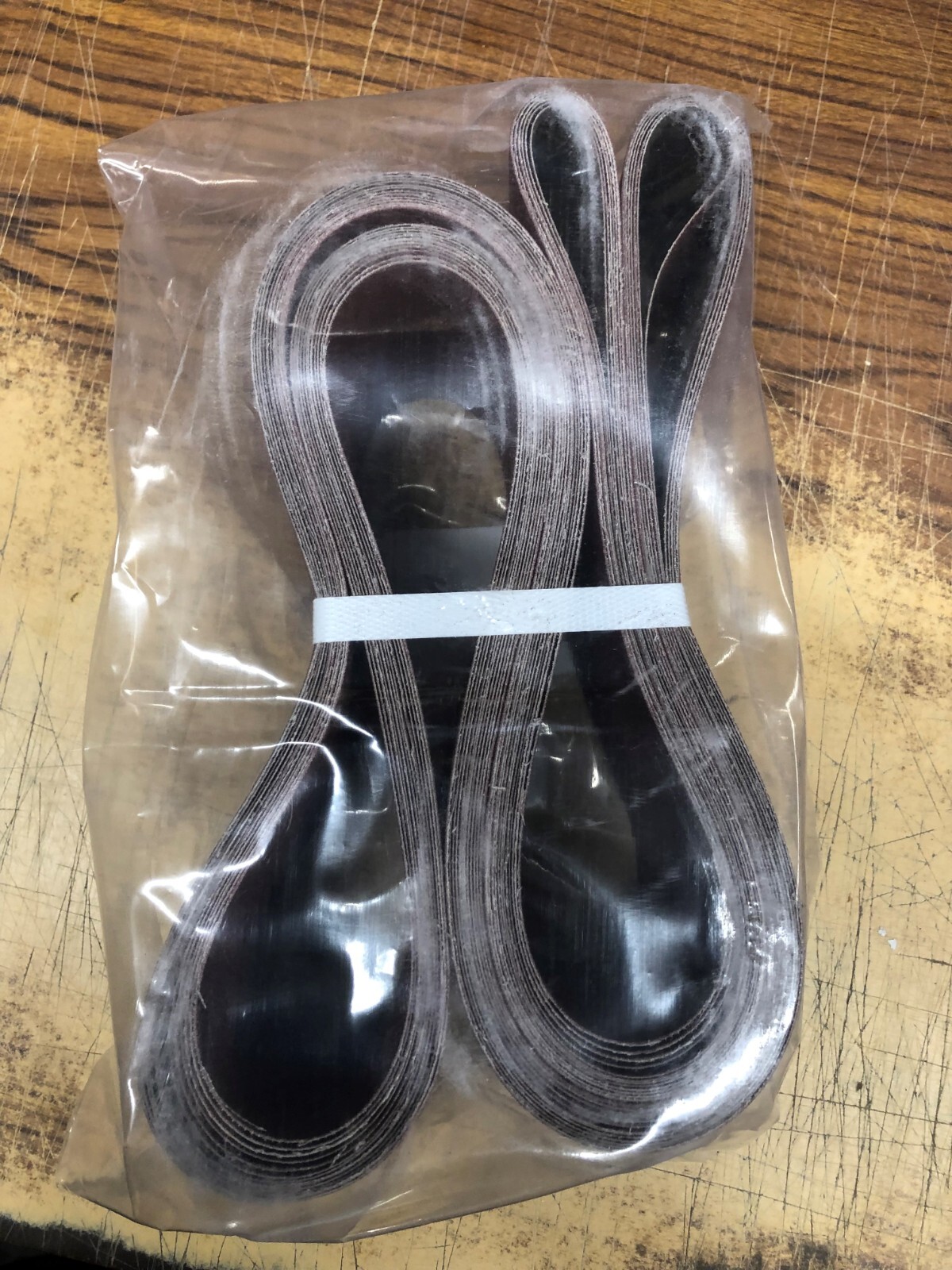 #260A100 4IN x 132IN ALUMINUM OXIDE CLOSED COAT CLOTH SANDING BELT 100 GRIT
