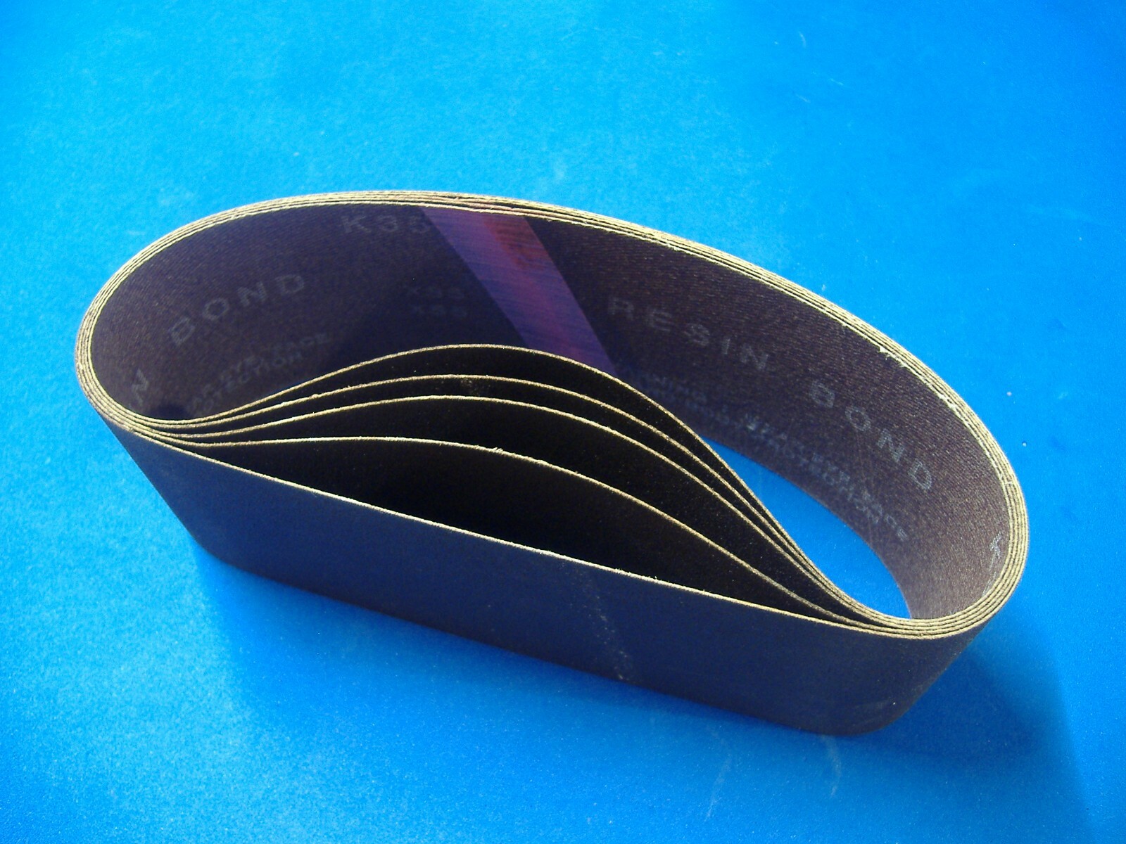 FIVE 2 1/2″ X 16″ SANDING BELTS 180 GRIT