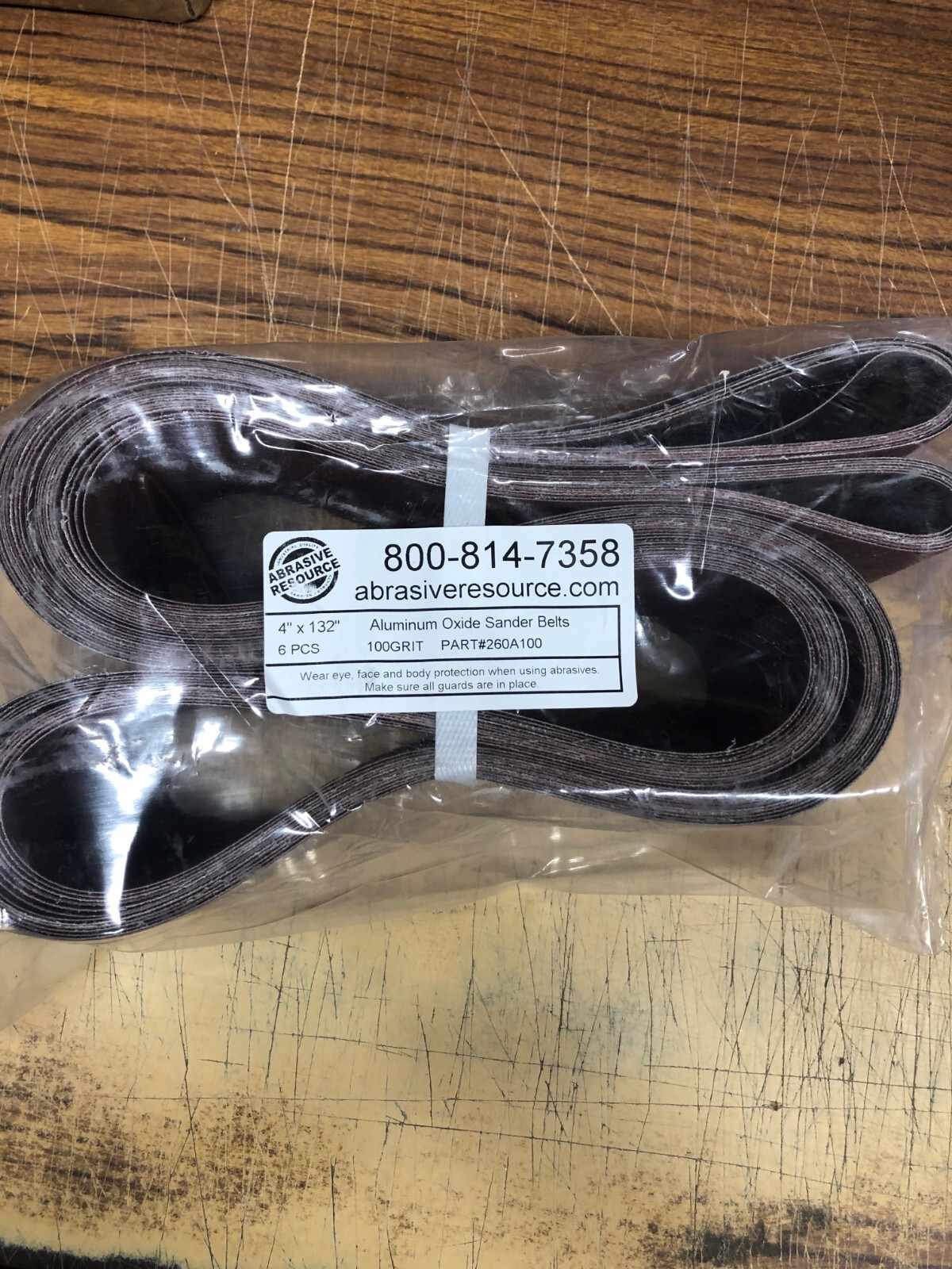 #260A100 4IN x 132IN ALUMINUM OXIDE CLOSED COAT CLOTH SANDING BELT 100 GRIT