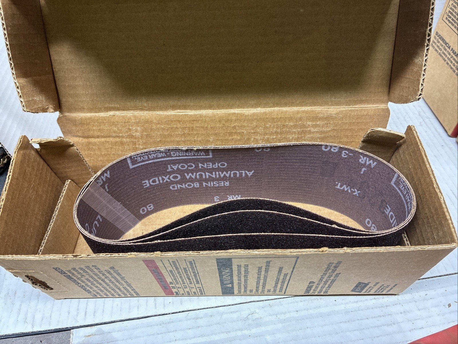 Lot Of 4 Boxes Of 3″ X 21″ Aluminum Oxide Belt Open Boxes See Description